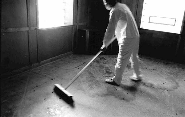 Giles Denmark performing twelve-day performance installation Clean House at National Purity Soap Factory, Minneapolis, 1995